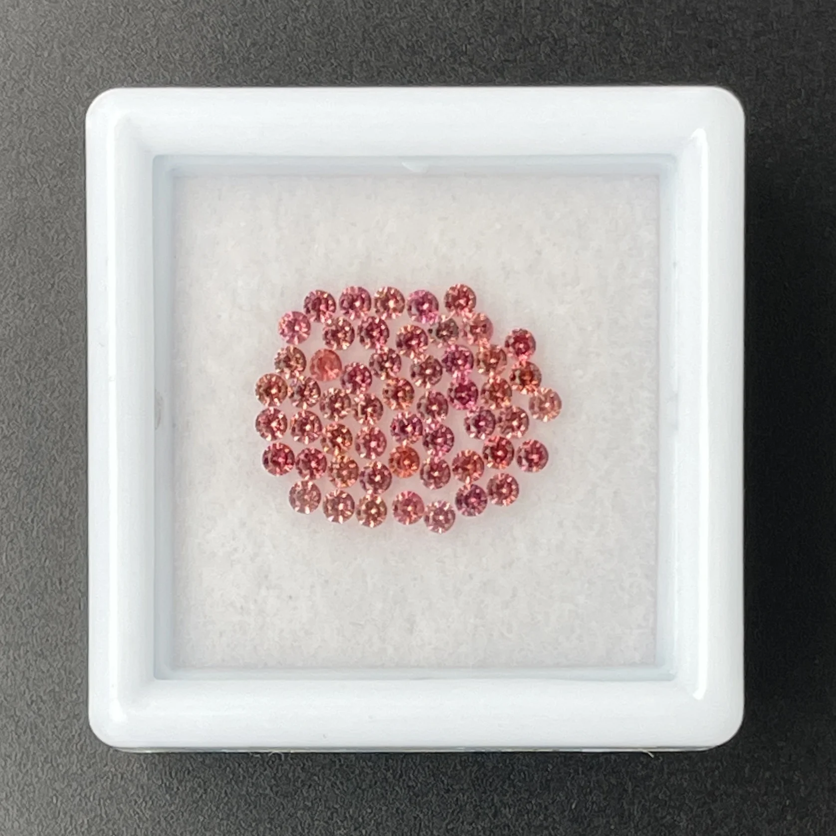 SFC026P1 Sapphire Parcel (53 pcs) | 1.50 mm Precision-Cut Brilliant | Pinkish Orange | Songea, Tanzania - Image 1