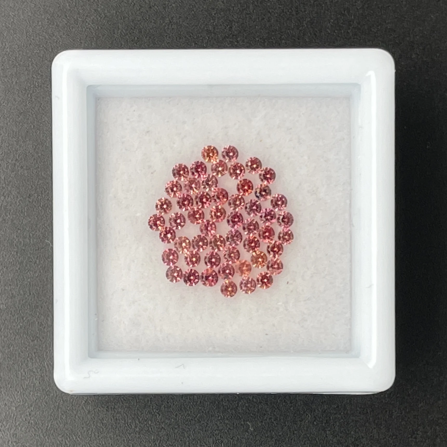 SFC029P1 Sapphire Parcel (52 pcs) | 1.50 mm Precision-Cut Brilliant | Pinkish Orange | Songea, Tanzania - Image 1