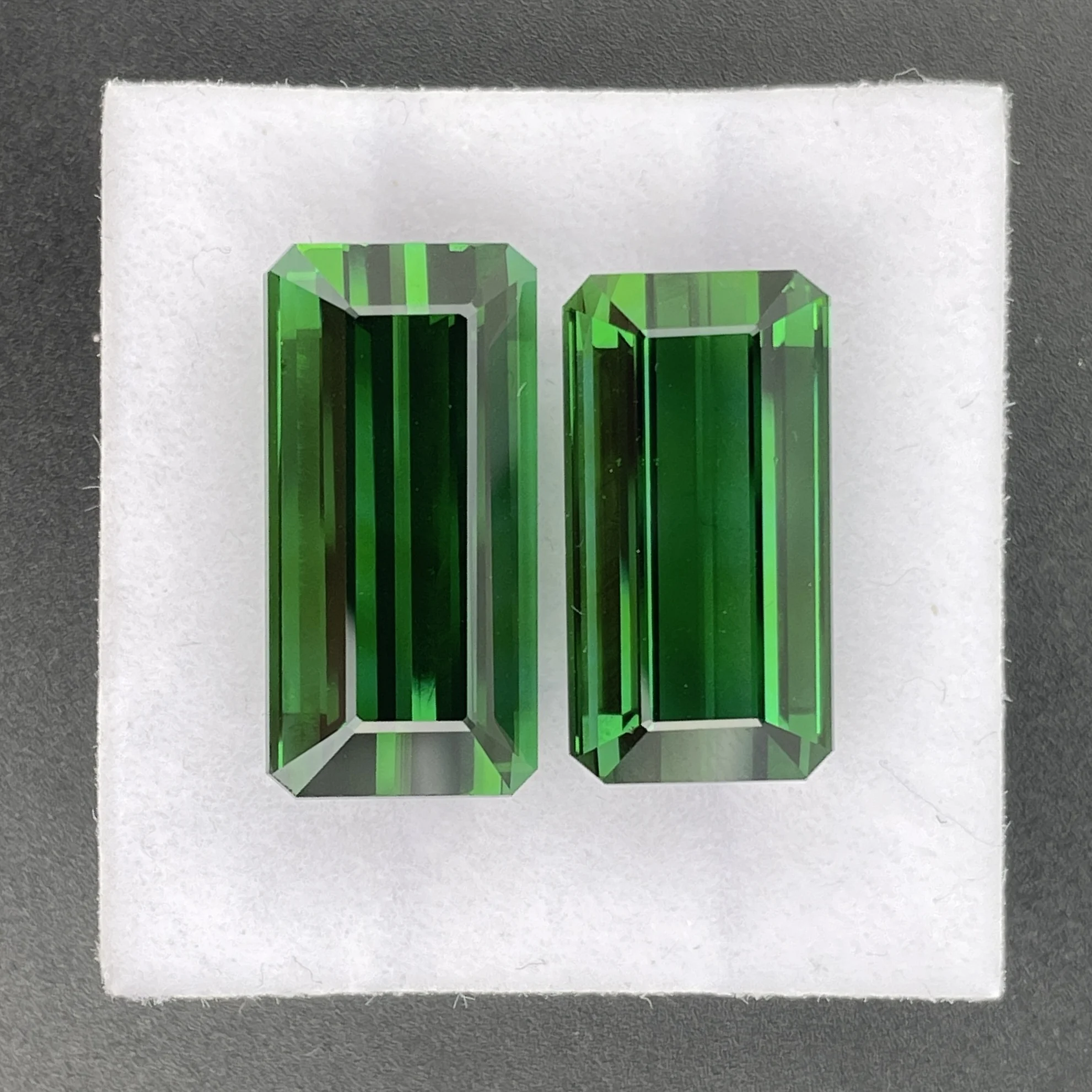 TOP037P1 Tourmaline Companion Pair 32.27 ct | Emerald Cut | Bottle Green | Rubaya, Congo (DRC) - Image 1